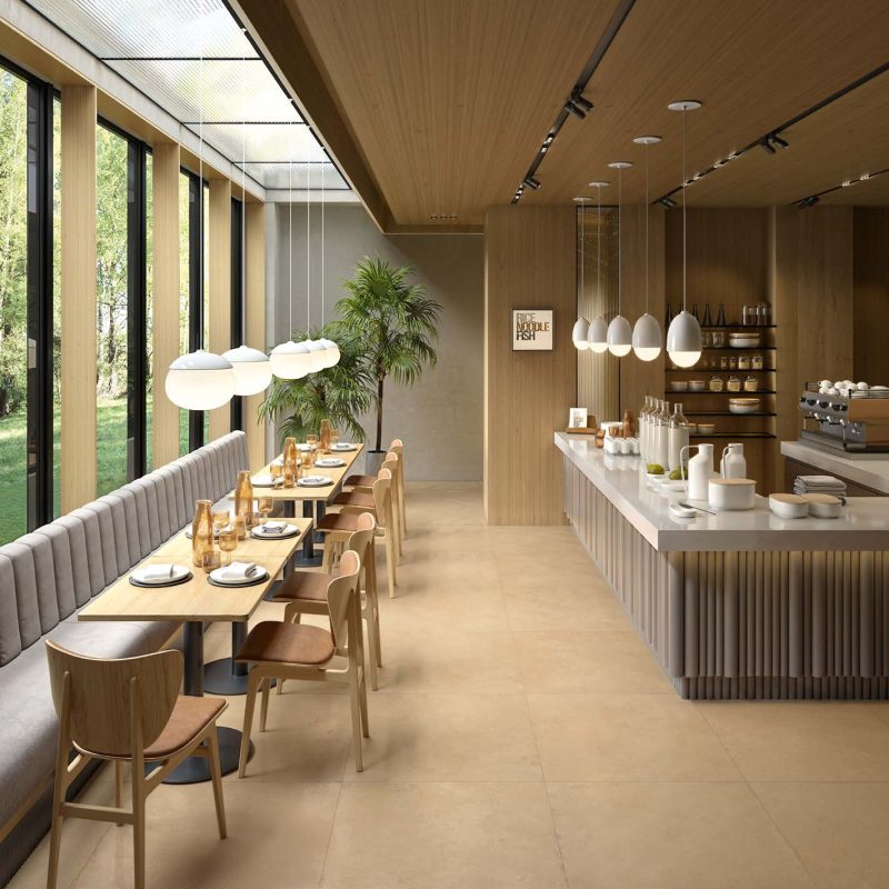 Carrelage sol grand format effet béton ciré jaune Ueno Ochre ambiance restaurant